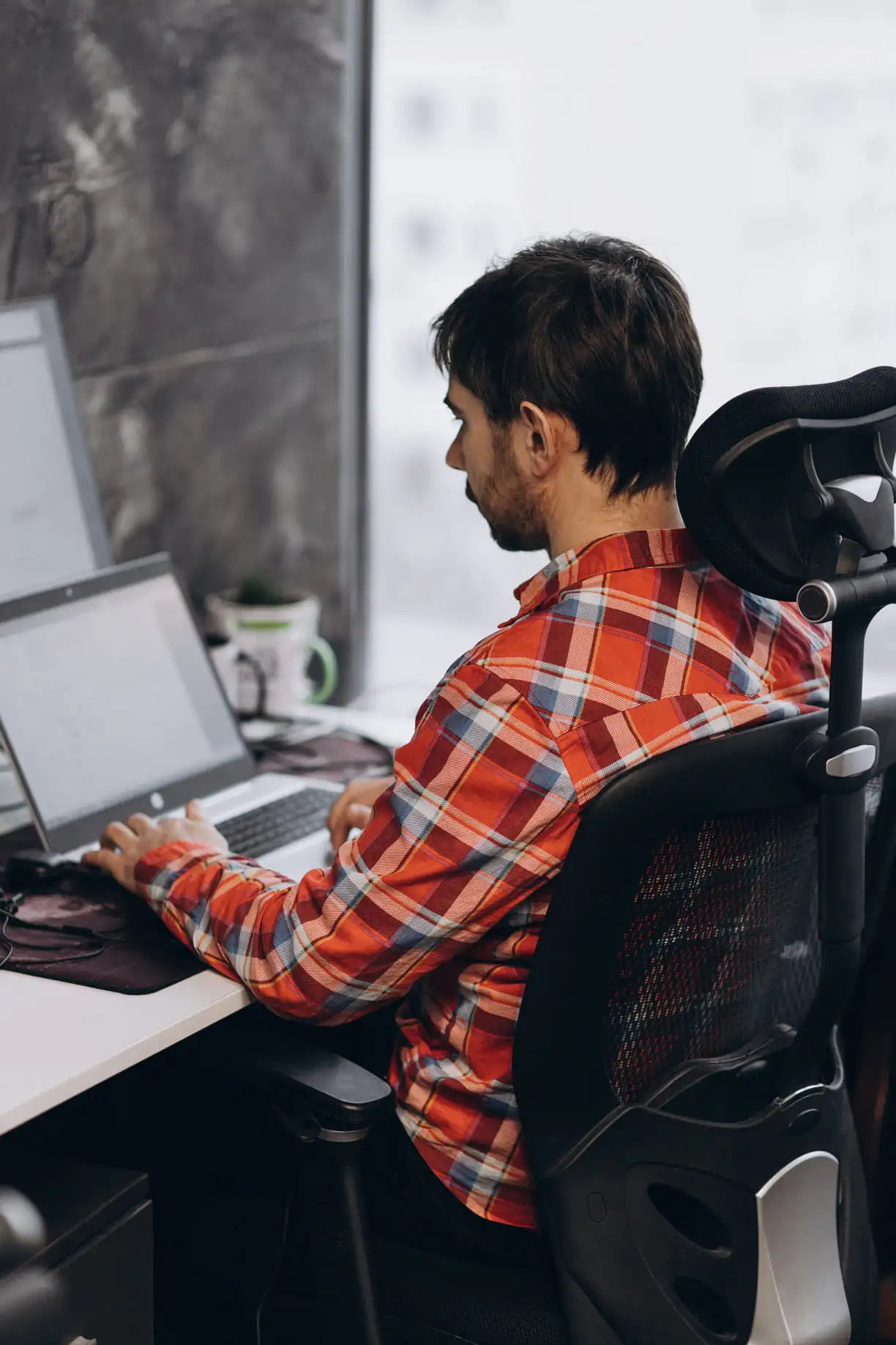 Developer on chair during work