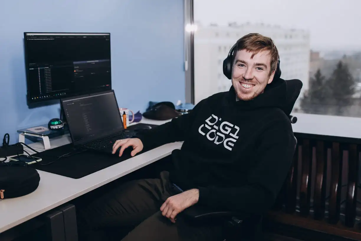 Smiling guy with laptop