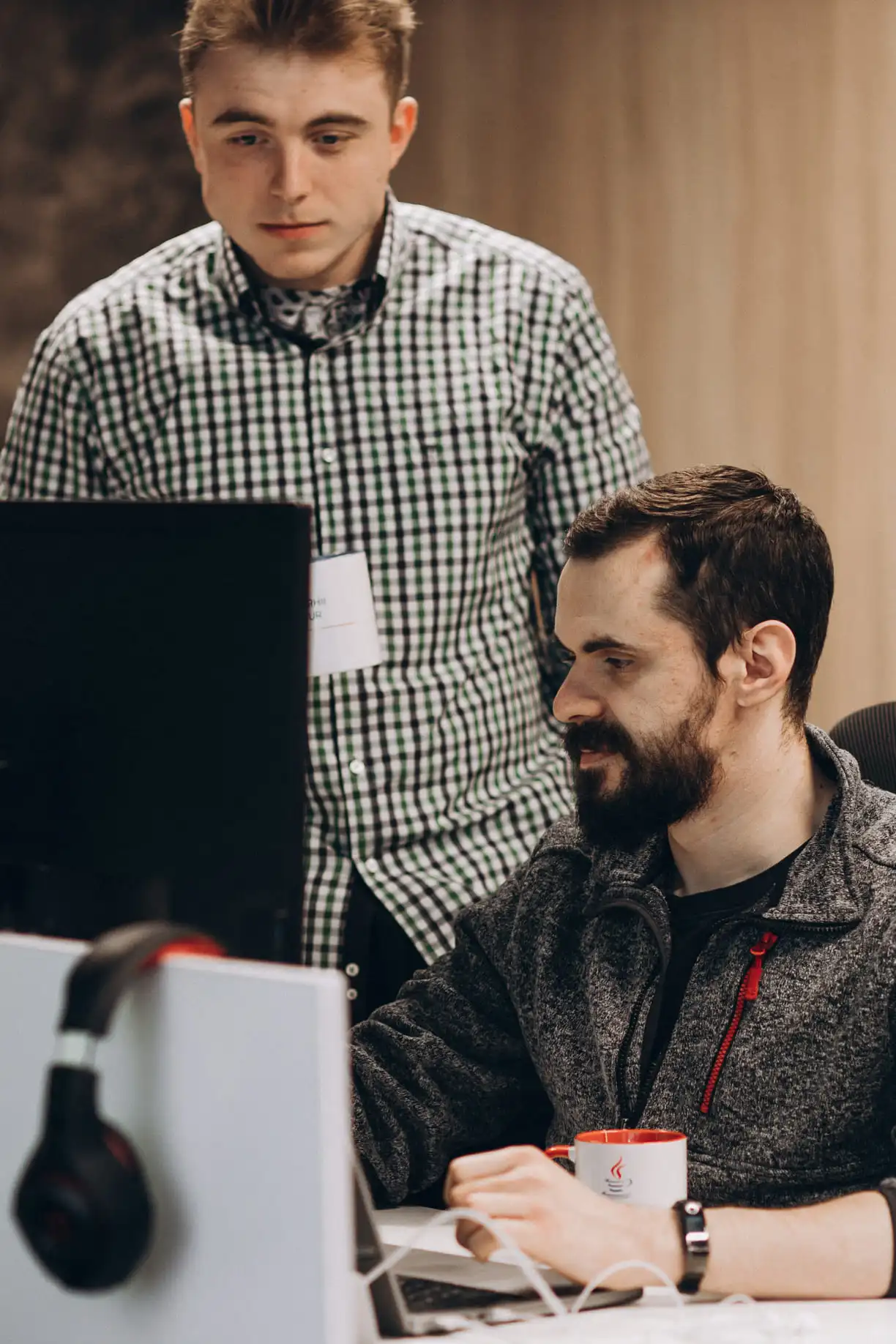 Two developers in front of monitor